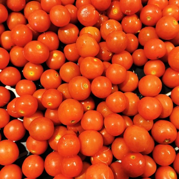 Close-up of a pile of ripe red cherry tomatoes